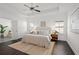 Spacious primary bedroom with tray ceilings, ceiling fan, and abundant natural light at 330 Wagon Way, Alpharetta, GA 30009