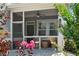 Relaxing screened-in patio with seating area, ceiling fan, and view of the backyard at 330 Wagon Way, Alpharetta, GA 30009