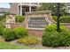 Entrance sign for Enclave at Wills Park community, set among manicured landscaping and brick accents at 330 Wagon Way, Alpharetta, GA 30009