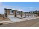 Row of new townhomes with attached garages and landscaping at 224 Sanctuary Dr # 66, Mcdonough, GA 30253