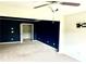 Bonus room featuring dark blue accent wall and carpeted floors at 389 Meeting St, Mcdonough, GA 30252