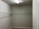 This walk in closet features wire shelving and neutral walls over carpeted floors at 389 Meeting St, Mcdonough, GA 30252