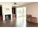 Spacious living room with a cozy fireplace, built-in shelving, and lots of natural light perfect for gathering at 389 Meeting St, Mcdonough, GA 30252