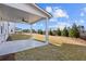 Covered patio and backyard view, offering a relaxing outdoor space at 6300 Misty Hill Ln, Buford, GA 30518
