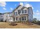 Two-story house with gray and beige brick exterior and landscaping at 6300 Misty Hill Ln, Buford, GA 30518