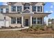 Two-story home's front porch with brick exterior and landscaping at 6300 Misty Hill Ln, Buford, GA 30518