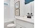 Stylish bathroom with white vanity, bathtub, and framed artwork at 366 Boundless Ln, Canton, GA 30114