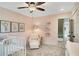 bedroom with pink walls, white chair, and grey carpet at 366 Boundless Ln, Canton, GA 30114