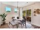 Bright dining area with sliding door access to screened porch at 366 Boundless Ln, Canton, GA 30114