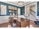 Stylish home office with a navy wall and hardwood floors at 366 Boundless Ln, Canton, GA 30114