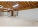 Unfinished basement with high ceilings and concrete floors at 503 W Green Ct, Woodstock, GA 30189