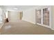 Finished basement with neutral carpeting and ample space at 503 W Green Ct, Woodstock, GA 30189