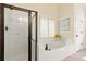 Bathroom with a soaking tub and a separate shower at 503 W Green Ct, Woodstock, GA 30189