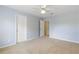 Light blue bedroom with carpet and ceiling fan, access to bath at 503 W Green Ct, Woodstock, GA 30189