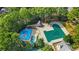 Aerial view of community pool with multiple pools, a slide, and gazebo at 503 W Green Ct, Woodstock, GA 30189