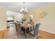 Elegant dining room with hardwood floors and chandelier at 503 W Green Ct, Woodstock, GA 30189