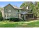 Two-story home with screened porch and large backyard at 503 W Green Ct, Woodstock, GA 30189