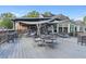 Outdoor patio with tables and chairs under shade at 503 W Green Ct, Woodstock, GA 30189