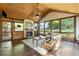 Relaxing screened porch with fireplace and wood flooring at 503 W Green Ct, Woodstock, GA 30189