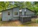 Backyard of home featuring a deck and green space with shade trees at 626 Dover St, Marietta, GA 30066