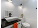 Contemporary half bathroom with a modern sink and fixture and toilet at 626 Dover St, Marietta, GA 30066