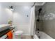 Modern bathroom featuring a shower over the tub, a sink, and a toilet at 626 Dover St, Marietta, GA 30066