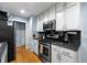 Well-appointed kitchen features stainless steel appliances and ample cabinet storage at 626 Dover St, Marietta, GA 30066