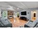 Bright living room features a stone fireplace, hardwood floors, and a comfortable seating area at 626 Dover St, Marietta, GA 30066