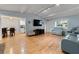 Open living room with hardwood floors and a view into the adjacent dining area at 626 Dover St, Marietta, GA 30066
