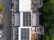 An aerial view shows the roof-top solar panels and patio furniture of this modern home at 1017 Brandsford Nw St, Atlanta, GA 30318