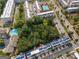 Aerial view of community featuring modern townhomes with solar panels and nearby pool amenities at 1017 Brandsford Nw St, Atlanta, GA 30318