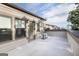 Open balcony featuring gray siding, a doorway, and modern outdoor lighting at 1017 Brandsford Nw St, Atlanta, GA 30318