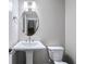 Half bathroom showcasing a pedestal sink and modern fixtures at 1017 Brandsford Nw St, Atlanta, GA 30318