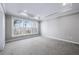 Carpeted bedroom with abundant natural light from large windows at 1017 Brandsford Nw St, Atlanta, GA 30318