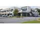 Multi-tenant commercial building featuring a mix of retail and restaurant spaces with ample parking at 1017 Brandsford Nw St, Atlanta, GA 30318