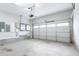 Spacious, bright garage with a clean concrete floor, white walls, and a modern sectional door at 1017 Brandsford Nw St, Atlanta, GA 30318