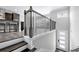 Hallway with railing and white door leading to another room in this home at 1017 Brandsford Nw St, Atlanta, GA 30318