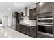 Modern kitchen boasts stainless steel appliances and ample counter space for culinary creations at 1017 Brandsford Nw St, Atlanta, GA 30318