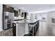 Modern kitchen with stainless steel appliances, large island, and open floor plan to living area at 1017 Brandsford Nw St, Atlanta, GA 30318