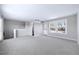 Open-concept living area with large windows and modern finishes, great for entertaining at 1017 Brandsford Nw St, Atlanta, GA 30318