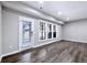 Living room with hardwood floors, recessed lights, and a glass door to the outdoors at 1017 Brandsford Nw St, Atlanta, GA 30318