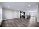Spacious living room featuring hardwood floors with kitchen and island view at 1017 Brandsford Nw St, Atlanta, GA 30318