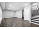Hardwood floors and recessed lights brighten this living room with access to a stairway at 1017 Brandsford Nw St, Atlanta, GA 30318