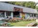Outdoor seating area at a local brewery with picnic tables set on a well-manicured lawn at 1017 Brandsford Nw St, Atlanta, GA 30318