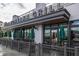 Ted's Montana Grill featuring an outdoor seating area and green umbrellas at 1017 Brandsford Nw St, Atlanta, GA 30318