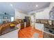 Modern kitchen featuring stainless steel appliances, granite countertops, and hardwood floors at 15 Sweet Cane Ct, Grayson, GA 30017