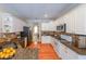 Modern kitchen with granite countertops, stainless steel appliances, white cabinetry, and hardwood floors at 15 Sweet Cane Ct, Grayson, GA 30017