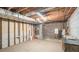 Unfinished basement featuring exposed ductwork, cinder block walls and unfinished walls at 2601 Round Ridge Rd, Loganville, GA 30052