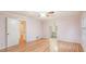 Well-lit bedroom featuring wood flooring, light-colored walls, and easy access to the ensuite bathroom at 2601 Round Ridge Rd, Loganville, GA 30052