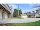 Exterior view of the home with detached garages and long, concrete driveway leading up to each garage at 2601 Round Ridge Rd, Loganville, GA 30052